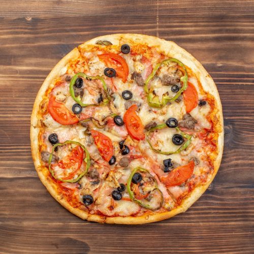 top-view-delicious-cheese-pizza-brown-wooden-surface